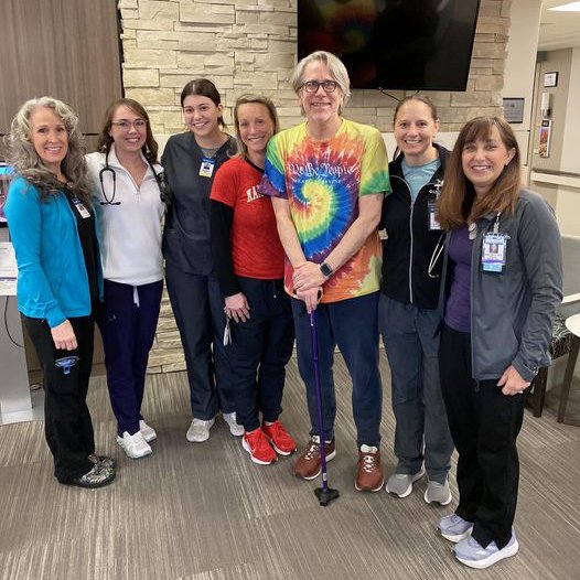 Tony Silvestri stands surrounded by his care team