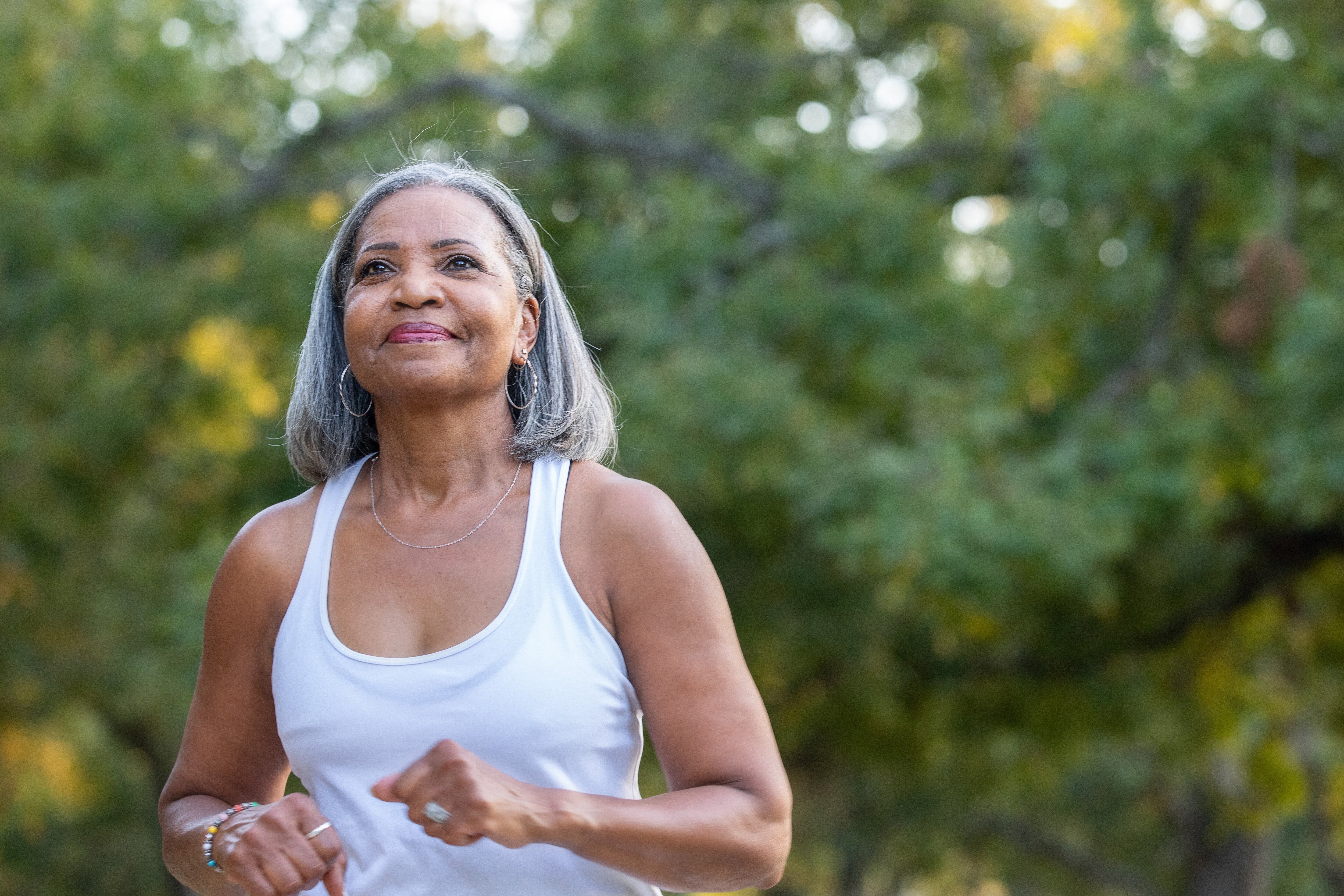 Senior woman jogging in a park