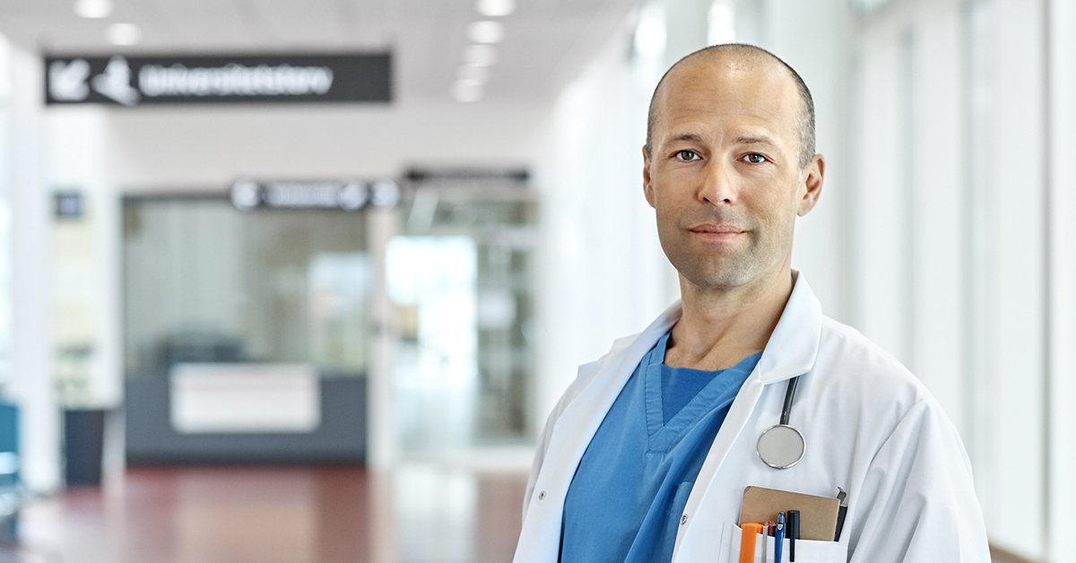 Doctor facing camera in hallway