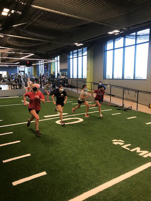 Claire Wilson, Natalie Kenney, Emma Roman Nose and Isabelle Klisch perform a stride drill