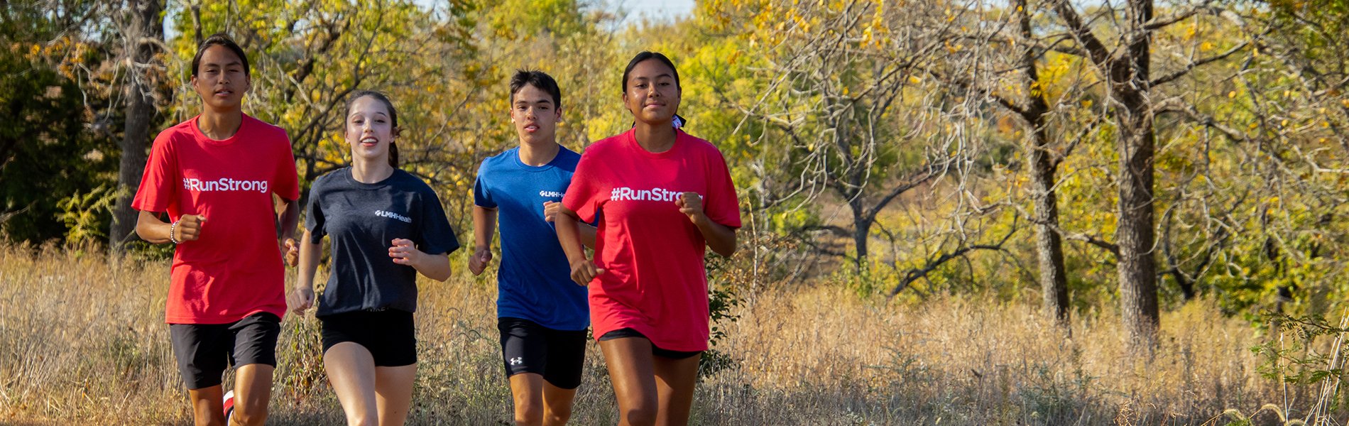 Runners on a track viewed from the knees down